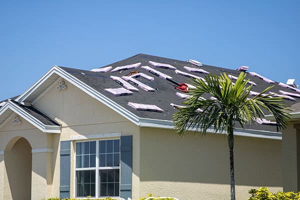 Damaged roof being repaired